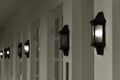 Row of vintage lamps light on wall