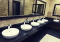 Row of wash basins with mirrors in a public toilet Royalty Free Stock Photo