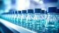 Row of Water Bottles on Shelf for the Pharmacology Industry. Bottles with medicines on the conveyor. Selective focus. Close-up