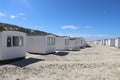 Row of white cabins on the Lokken beach, Denmark