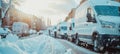 Row of white delivery vans in winter day, transport service company concept with copy space Royalty Free Stock Photo