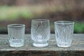 A row of white one three glass crystal goblets Royalty Free Stock Photo