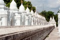 Row of white pagodas in Kuthodaw temple,Myanmar. Royalty Free Stock Photo