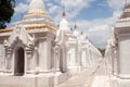 Row of white pagodas in Maha Lokamarazein Kuthodaw Pagoda in My