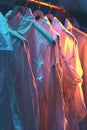 Row of White Shirts Hanging on Rack Royalty Free Stock Photo