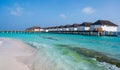 Row of white tropical houses above the sea Royalty Free Stock Photo