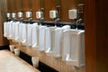 row of White urinal no people in clean toilet in hotel