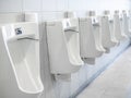 Row of white urinals in men toilet Royalty Free Stock Photo