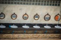 Row of white wash basins in the bathroom with row of mirrors in Royalty Free Stock Photo