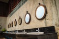 Row of white wash basins in the bathroom with row of mirrors in Royalty Free Stock Photo