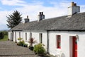 Row of whitewashed crofts in a Scottish village Royalty Free Stock Photo