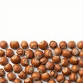 scattered group of whole hazelnuts in shell covering the lower third of the frame Royalty Free Stock Photo