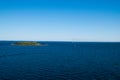 Row of wind turbines and a small island in Baltic Sea between Ge Royalty Free Stock Photo