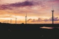 A row of windmills during golden hour in Bangui, Ilocos Norte, Philippines. Sustainable and renewable energy in Asia Royalty Free Stock Photo