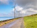 Row of Windturbines along a Dike Royalty Free Stock Photo