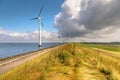 Row of Windturbines along a Dike Royalty Free Stock Photo