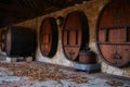 Row of wine barrels in an outside wall Royalty Free Stock Photo