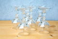 Row of wine glasses on wooden table with grey background Royalty Free Stock Photo