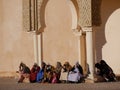 Row of women sitting in square, Meknes, Morocco