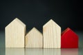 A row of wood home and a one red house. A symbol for the best home Royalty Free Stock Photo