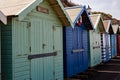 A row of wooden beach huts along the promenade on Cromer seafront. Most of the beach huts were in use by the owners, however these