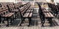 Row of wooden benches in park. Furniture Royalty Free Stock Photo