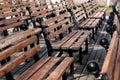 Row of wooden benches in park. Royalty Free Stock Photo