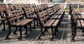 Row of wooden benches in park. Retro, vintage. Sunny day Royalty Free Stock Photo