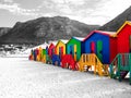 The row of wooden brightly colored huts.