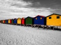 The row of wooden brightly colored huts. Royalty Free Stock Photo