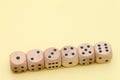 Row of wooden dice Royalty Free Stock Photo