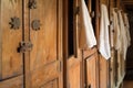 row of wooden lockers, doors ajar, towels hanging Royalty Free Stock Photo