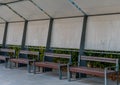 Park benches under canvas awning Royalty Free Stock Photo