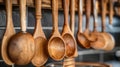 A row of wooden spoons and measuring cups hanging on a wall, AI Royalty Free Stock Photo
