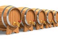 Row of wooden wine barrels with valves