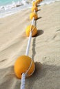 Yellow buoys on a sandy beach. Royalty Free Stock Photo