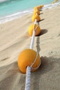 Yellow buoys on a sandy beach. Royalty Free Stock Photo