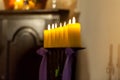 Row of yellow candles in the church Royalty Free Stock Photo