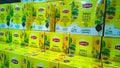 Row of yellow color packs of Lipton tea on the supermarket shelves. Retail industry. Healthy Unsweetened drinking concept. English