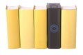 Row of yellow hardback books with a computer hard Royalty Free Stock Photo