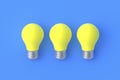 Row of yellow light bulbs on blue background Royalty Free Stock Photo