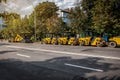 Row of yellow professional road rollers are ready for work Royalty Free Stock Photo