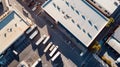 Row of Yellow Trucks Parked in Front of Warehouse Royalty Free Stock Photo