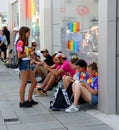 Young people using mobiles at Brighton Pride Festival Royalty Free Stock Photo