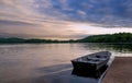 Rowboat Docked in a Lake at Sunset Royalty Free Stock Photo