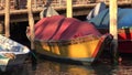 Rowboat Floating In River At Pier