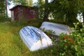 Rowboats in front of red shed Royalty Free Stock Photo