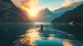 Rower in an idyllic lake in the alpine mountains during summer and autumn