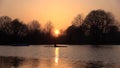 A rower on a lake in a dream sunset Royalty Free Stock Photo