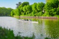 Rowers Rowing a Skiff on a Water River Royalty Free Stock Photo